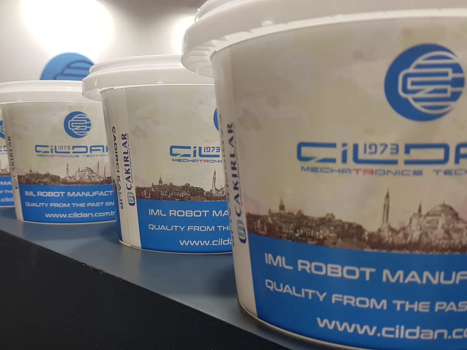 Plastic buckets labelled with IML